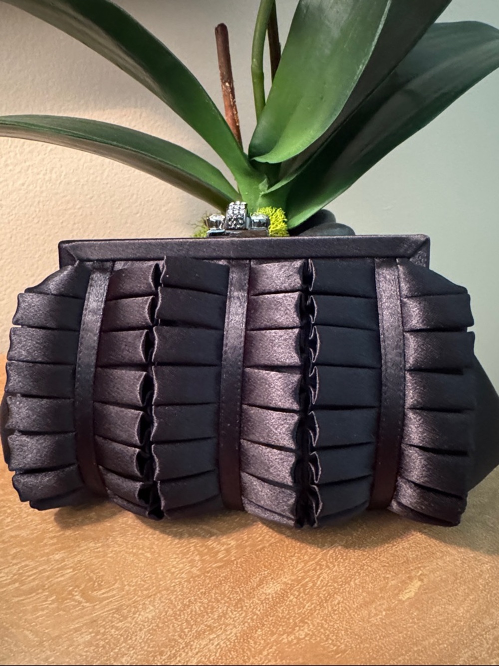 New without tags black satin evening clutch with crystal clasp.